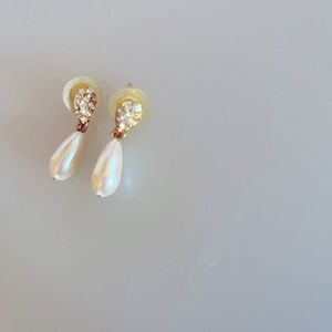 Post earrings. Pearl like drop.  Diamond like accent.  Not genuine of course.